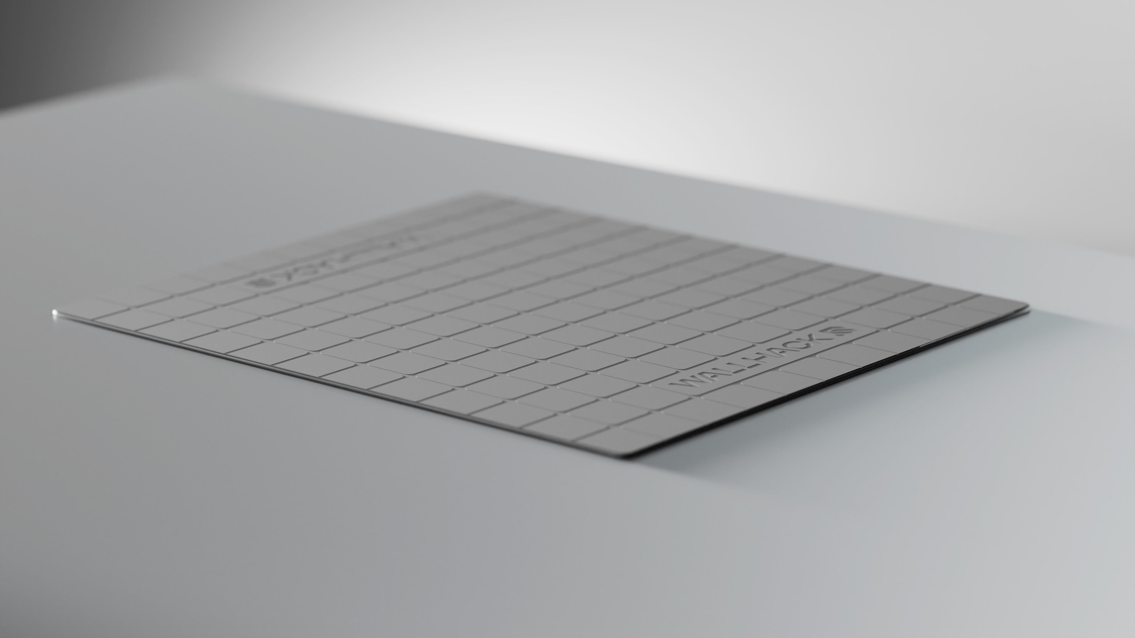The silicone bottom of a glass mouse pad with a white background