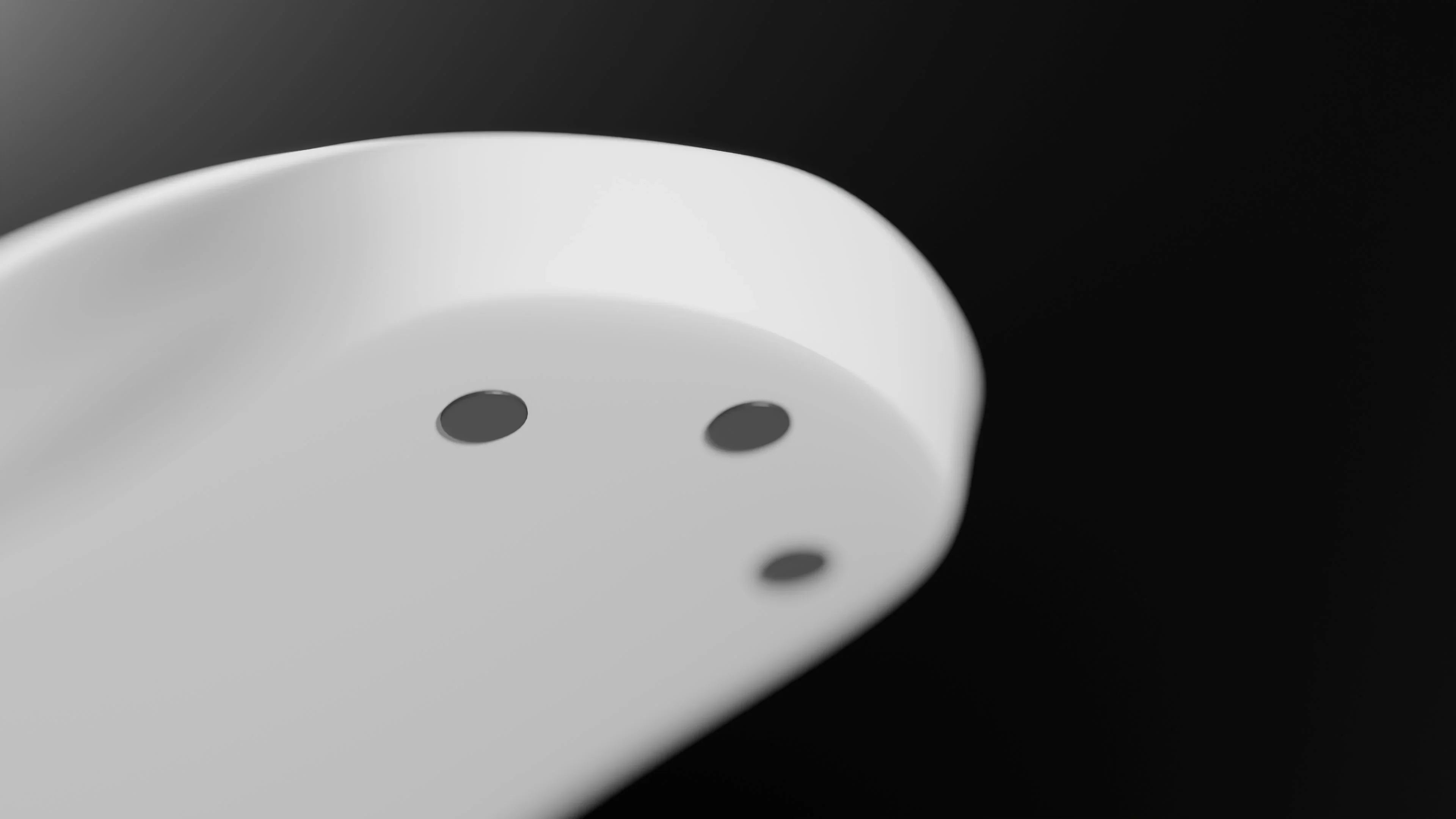 A macro shot of black colored UHMWPE dot skates on the bottom of a gaming mouse