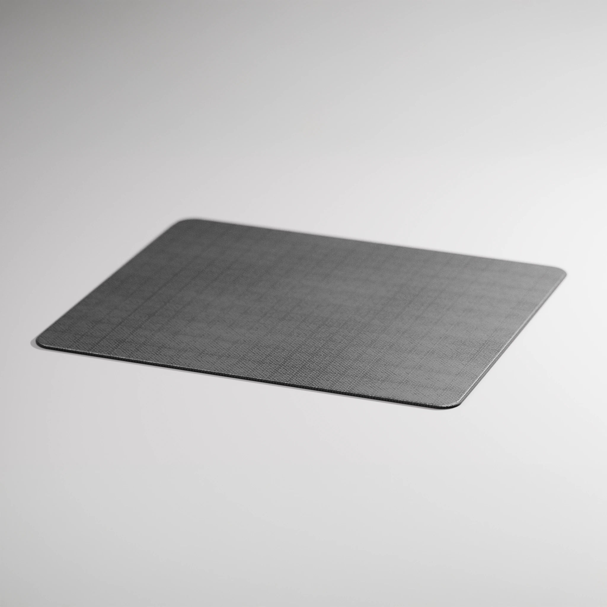 Gray textured mouse pad on a light gray background