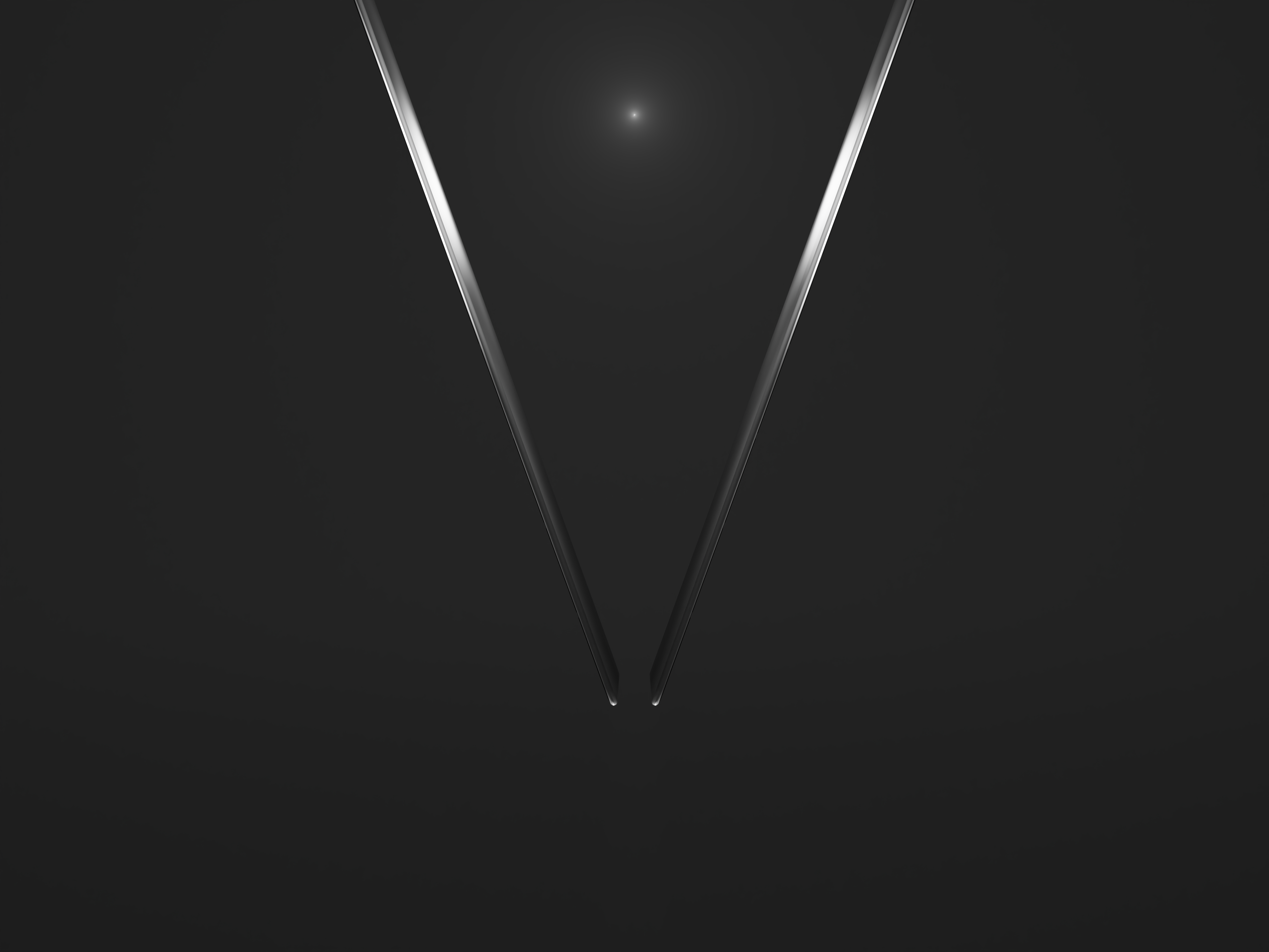 A mirrored image showing the reflection of a glass mouse pad in a V shape.