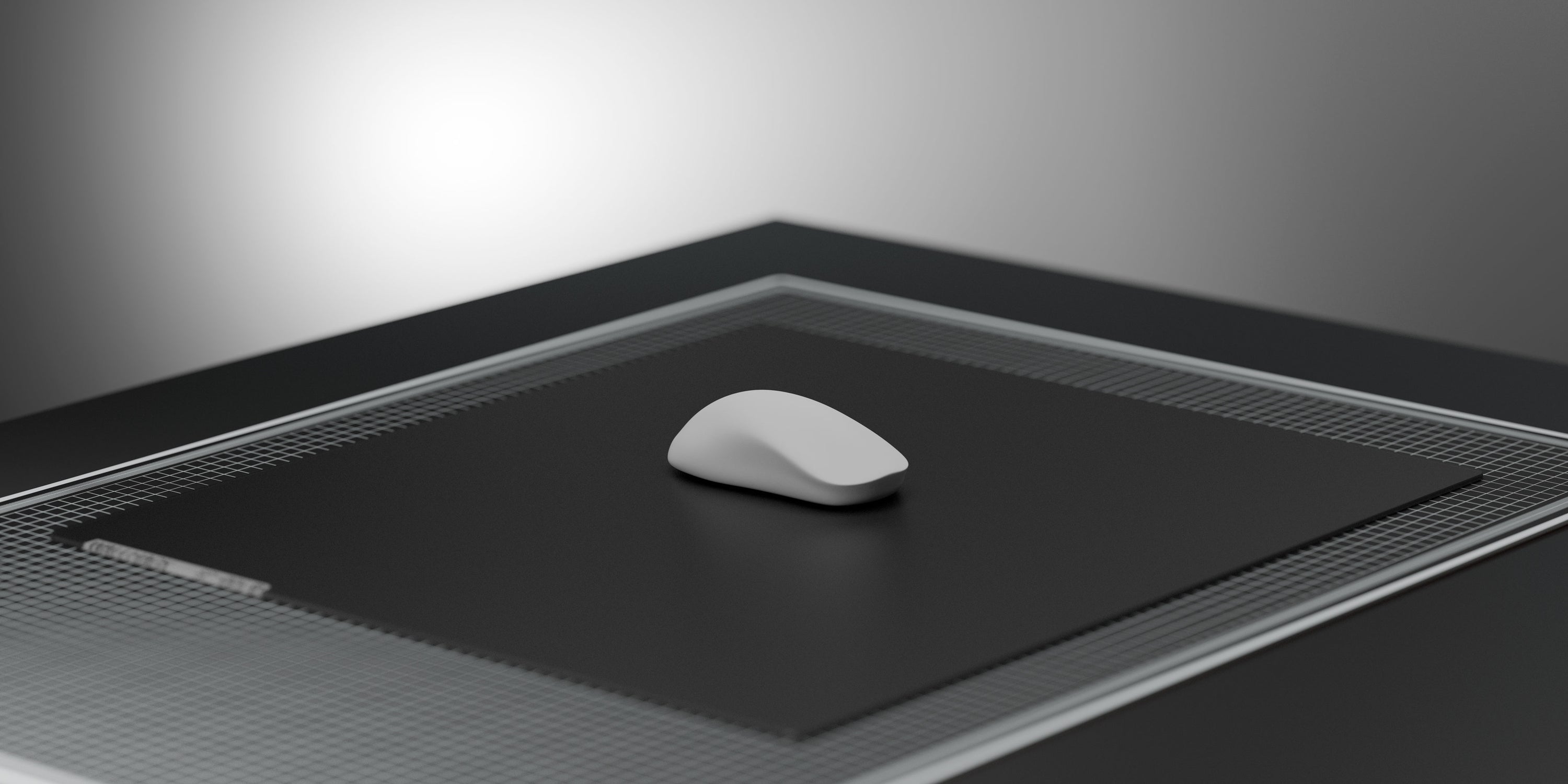 A white computer mouse model on a black glass mouse pad