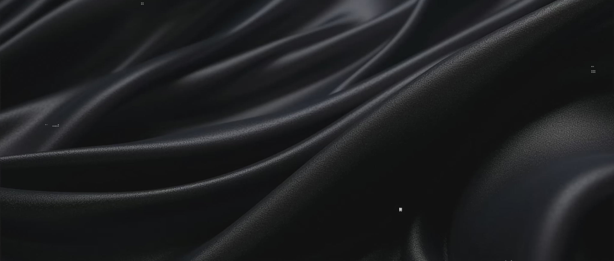 Close up of a cloth material for a mouse pad in black silky color