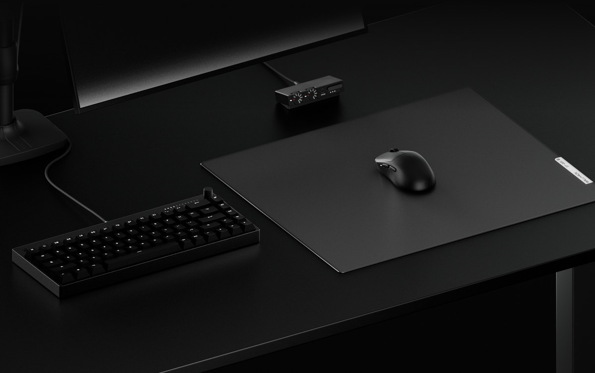 WALLHACK pad, mouse and keyboard on a desk