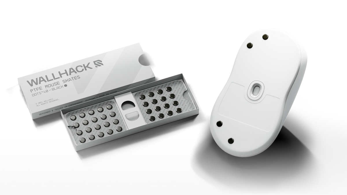An open WALLHACK skates box beside a white mouse