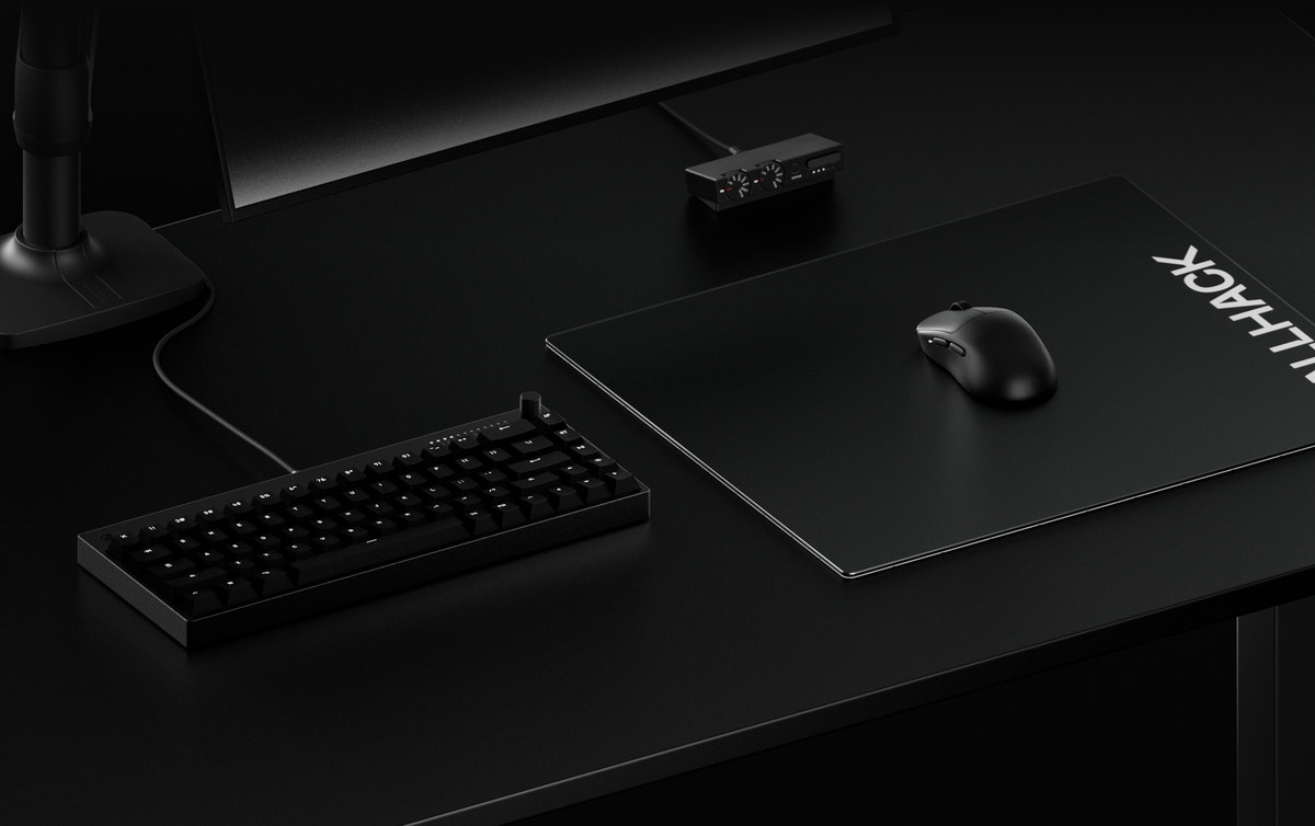 WALLHACK pad, mouse and keyboard on a desk